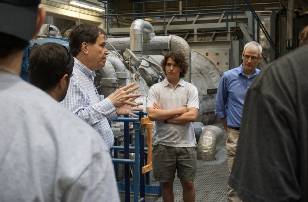 Clay Looney leads a plant tour through the PPE building with engineering students and Associate Professor David DiCarlo.