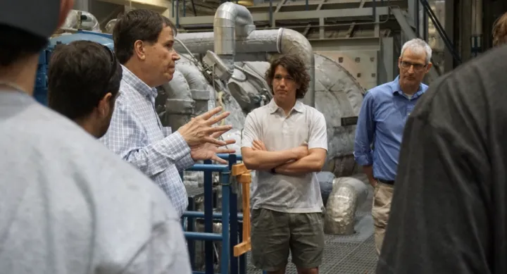 Clay Looney leads a plant tour through the PPE building with engineering students and Associate Professor David DiCarlo. Clay Looney leads a plant tour through the PPE building with engineering students and Associate Professor David DiCarlo.